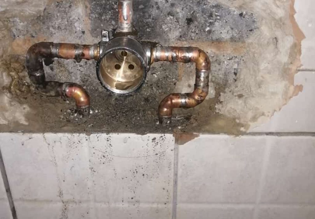 Exposed pipes and valves requiring emergency plumbing service